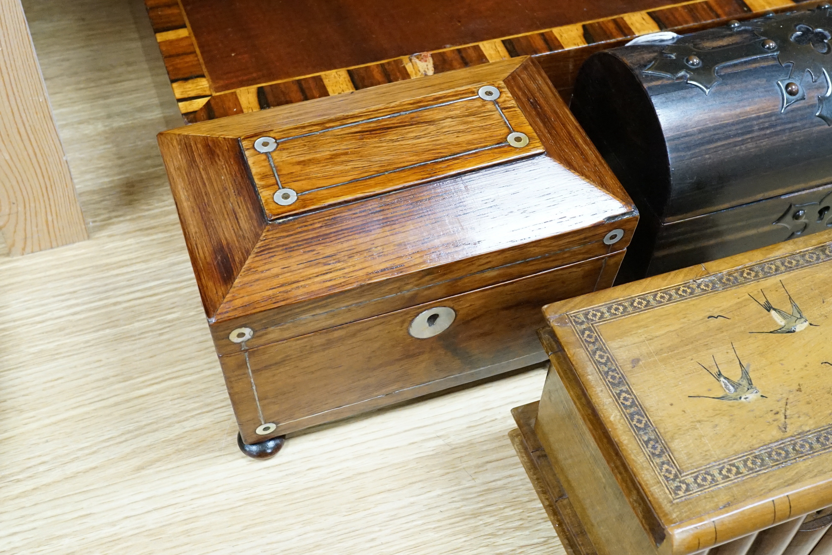 A Victorian coromandel stationary box, a rosewood tea caddy, an olive wood jewellery casket, a mahogany box and a chinoiserie panel, largest 41cm wide